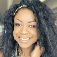 Nia Berry, Client Care Coordinator, smiling